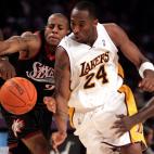 Lakers' Kobe Bryant drives past 76ers' defender Andre Iguodala in the fourth quarter of play during the Lakers' 10494 win Sunday, December 31, 2006 at Staples Center.  (Photo by Myung J. Chun/Los Angeles Times via Getty Images)