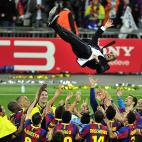 FC Barcelona's Spanish coach Josep Guardiola is thrown in the air in celebration after Barcelona defeated Manchester United 3-1 during their UEFA Champions League final football match on May 28, 2011 at Wembley stadium in London. AFP PHOTO / GLY...