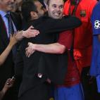 Barcelona's Andres Iniesta (right) celebrates with manager Josep Guardiola as they recieve their winners medals.
