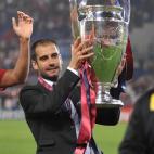 Barcelona´s coach Josep Guardiola holds the Champions League Cup after the trophy ceremony on May 27, 2009 at the Olympic Stadium in Rome. Barcelona defeated Manchester United 2-0 in the final of the UEFA football Champions League. AFP PHO...