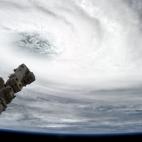"Eye of the Storm - Tropical Cyclone Haruna, today over Madagascar, with Canadarm2 pointing at the eye."