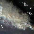 This photo, taken by Astronaut Chris Hadfield from the International Space Station, Tuesday Jan. 8, 2013 shows a view of the wildfires in Australia. (AP Photo/NASA, Chris Hadfield)