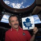 Canadian astronaut Chris Hadfield holds a Toronto Maple Leafs sign on a photo posted to his Twitter account on Jan. 6, 2013. Professing his support for Toronto did not sit well with a number of hockey fans. Hadfield is on a five-month visit to t...