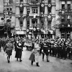An undated picture shows nazi Chancellor Adolf Hitler followed by commander-in-chief Hermann Goering (2nd L) and head of the SS Heinrich Himmler (3rd L) marching in Berlin next to the hotel Excelsior which was Hitler's base in the city in the ea...