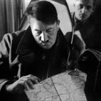 An undated picture shows German Nazi Chancellor Adolf Hitler in a plane looking at a map with Governor-general of Nazi-occupied Poland, Hans Frank in the background. AFP PHOTO / FRANCE PRESSE VOIR (Photo credit should read -/AFP/Getty Images)