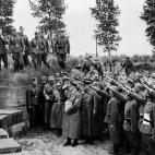 A picture taken in June 1940 during World War II at Langemark German cemetery, nazi Chancellor Adolf Hitler pays tribute to German soldiers fallen during the First World War as he visits the German troops on the border between France and Belgium...