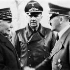 French Head of State Philippe Petain (L) shakes hands with German Chancellor Adolf Hitler in Montoire-sur-le-Loir, western France, on October 24, 1940 during talks at the end of which Petain agreed to Hitler's conditions including the collaborat...
