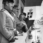 A picture dated 1939 shows German nazi Chancellor and dictator Adolf Hitler (2nd L) and Italian Duce Benito Mussolini smiling from a balcony with the Italian Kingdom's flag in the background. AFP PHOTO / FRANCE PRESSE VOIR (Photo credit should r...