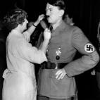 A picture taken on November 24, 1938 shows the wax figure of German Nazi Chancellor Adolf Hitler having his moustache combed by a hairdresser at Madame Tussauds Wax museum in London. AFP PHOTO / FRANCE PRESSE VOIR (Photo credit should read -/AFP...