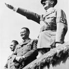 FILE - In this July 31, 1938, file photo German Chancellor Adolf Hitler salutes a huge crowd at a sports meeting in Breslau, Germany. Former Liberian President Charles Taylor is part of a long parade of leaders guilty or accused of similar, and ...