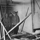 GERMANY - JULY 20: (L-R) Deposed Italian dictator Benito Mussolini, German officer Paul Schmidt and Adolf Hitler survey damage at Hitler's bunker HQ Wolfschanze, aka the Wolf's Lair, hours after a failed bombing attempt on his life by members of...