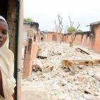 A female student stands in a burnt classroom at Maiduguri Experimental School, a private nursery, primary and secondary school burnt by the Islamist group Boko Haram to keep children away from school in Maiduguri, northeastern Nigeria, May 12, 2...