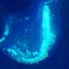 Imagen tomada el 17 de julio de 2015 por el OLI del Landsat 8 en el arrecife Trunk Reef cerca de Townsville, Australia.