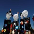 Manifestaciones y pancartas con las caras de los l&iacute;deres durante el G-7 en Biarritz.