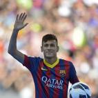 FC Barcelona's new signing Neymar gestures waves to the crowd during his official presentation at the Camp Nou stadium in Barcelona, Spain, Monday, June 3, 2013. Neymar arrived in Barcelona on Monday to complete his deal with the Catalan club, w...