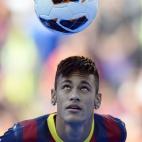 FC Barcelona's new signing Neymar controls the ball during his official presentation at the Camp Nou stadium in Barcelona, Spain, Monday, June 3, 2013. Neymar arrived in Barcelona on Monday to complete his deal with the Catalan club, which will ...