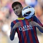 FC Barcelona's new signing Neymar controls the ball during his official presentation at the Camp Nou stadium in Barcelona, Spain, Monday, June 3, 2013. Neymar arrived in Barcelona on Monday to complete his deal with the Catalan club, which will ...