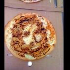 Owners of Brisbane, Australia's Posh Pizza shop say that the face of Jesus mysteriously appeared in one of their three-cheese pizzas.