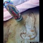 A mark resembling an outline of the Virgin Mary appears on a griddle at the Las Palmas restaurant in Calexico, Calif., in April. Manager Brenda Martinez said that more than 100 people had come to see the likeness, which first appeared when the g...
