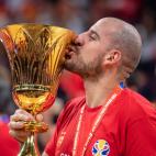 BEIJING, CHINA - SEPTEMBER 15: Quino Colom of Spain kisses the trophy as he celebrates their victory at the cup ceremony after winning the FIBA World Cup 2019 match against the Argentina National Team at Beijing Wukesong Sport Arena on September...