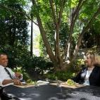 In this handout provided by the White House, President Barack Obama has lunch with former Secretary of State Hillary Rodham Clinton on the patio outside the Oval Office, July 29, 2013 in Washington, D.C. (Photo by Chuck Kennedy/White House via G...