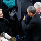President Barack Obama greets former president Bill Clinton and then-Secretary of State Hillary Clinton during the presidential inauguration on the West Front of the U.S. Capitol January 21, 2013 in Washington, DC. (Photo by Rob Carr/Getty Images)