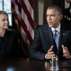 Hillary Clinton, then secretary of state, listens while President Barack Obama speaks during a cabinet meeting at the White House in Washington, D.C., U.S., on Wednesday, Nov. 28, 2012. (Photographer: T.J. Kirkpatrick/Bloomberg via Getty Images)