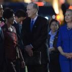 President Barack Obama and then-Thai Prime Minister Yingluck Shinawatra walk past U.S. representatives, including then-Secretary of State Hillary Clinton, during a welcoming ceremony at Government House in Bangkok on November 18, 2012. (CHRISTOP...