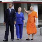 President Barack Obama and then-Secretary of State Hillary Clinton listen to the dean of the Faculty of Buddhism, Chaokun Suthee Thammanuwat, during a tour at the Wat Pho Royal Monastery in Bangkok on November 18, 2012. (JEWEL SAMAD/AFP/Getty Images)
