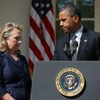 President Barack Obama makes a statement in response to the attack at the U.S. Consulate in Libya as then-Secretary of State Hillary Clinton looks on September 12, 2012 at the Rose Garden of the White House in Washington, D.C. (Photo by Alex Won...