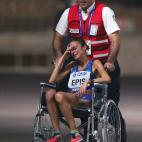 Athletics - World Athletics Championships - Doha 2019 - Women's Marathon - Doha, Qatar - September 28, 2019 Italy's Giovanna Epis is pushed in a wheelchair after sustaining an injury during the race REUTERS/Hannah Mckay