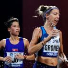 Roberta Groner, of the United States, pours water on herself during the women's marathon at the World Athletics Championships in Doha, Qatar, Saturday, Sept. 28, 2019. (AP Photo/Petr David Josek)