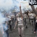 Femen activists hold placards reading "Not one more", "More heard dead than alive", "I didn't want to die" during a protest action dedicated to the memory of the women killed by their partner or ex-partner and against the violence against women,...