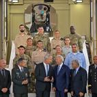 US President Joe Biden (4th R) listens to Israeli Defence Minister Benny Gantz (4th L), as they tour the Israel's missile defence system at Ben Gurion Airport near Tel Aviv on July 13, 2022 with caretaker Prime Minister Yair Lapid (3rd R), Israe...