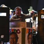 Colombian presidential left-wing candidate Gustavo Petro (C), speaks flanked by bodyguards holding bulletproof shields during his closing campaign rally at the Bolivar square in Bogota, Colombia on May 22, 2022. - Petro is leading the polls for ...