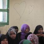 In this photo taken Sunday, Feb. 16, 2014, teenage girls attend an after-school club which the U.N. childrenâs agency UNICEF helps fund, one of whose subjects is discussion of the practice of female genital mutilation (FGM), at the Sheik Nu...
