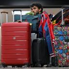 A passenger affected by the Ryanair strike waits to change their ticket to be able to travel at the Terminal 2 of El Prat airport in Barcelona on June 30, 2022. - Around thirty Ryanair flights departing from and arriving in Spain were canceled, ...