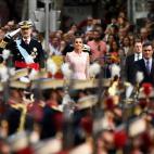 Spain´s King Felipe VI (L) salutes soldiers next to Queen Letizia (C) and Spanish Prime Minister Pedro Sanchez during the Spanish National Day military parade in Madrid on October 12, 2019. (Photo by OSCAR DEL POZO / AFP) (Photo by OSCAR DEL PO...