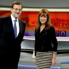 El presidente del Gobierno, Mariano Rajoy, y la directora de informativos de Antena 3, Gloria Lomana.