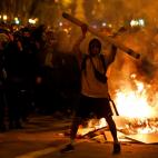 Protestors start fires in the street during clashes with police in Barcelona, Spain, Wednesday, Oct. 16, 2019. Spain's government said Wednesday it would do whatever it takes to stamp out violence in Catalonia, where clashes between regional ind...