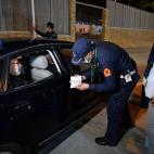 Ceuta (Spain), 17/05/2022.- People are stopped by authorities at a border crossing while leaving the Moroccan city of Fnidef, as seen from Ceuta, Spanish enclave in northern Africa, 17 May 2022. The border between Ceuta and Melilla and northern ...