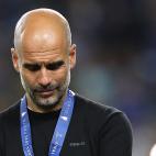 Manchester City's Spanish coach Josep Guardiola reacts at the end of the UEFA Champions League final football match between Manchester City and Chelsea FC at the Dragao stadium in Porto on May 29, 2021. (Photo by Jose Coelho / various sources / ...
