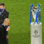 PORTO, PORTUGAL - MAY 29: Pep Guardiola the manager / head coach of Manchester City walks past the UEFA Champions League trophy during the UEFA Champions League Final between Manchester City and Chelsea FC at Estadio do Dragao on May 29, 2021 in...