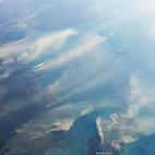 La astronauta Karen Nyberg tomó esta foto el 5 de agosto desde la EEI y capturó el humo que emanaba de un fuego incontrolado en Darwin y de la quema de rastrojos en la Isla Melville.