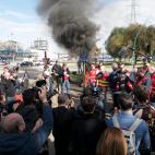 TOPSHOT - Unionists gather at the Gravenchon-Port-Jerome refinery, owned by US giant Esso-ExxonMobil, on October 12, 2022 in Port-Jerome, Normandy, where fuel depot personnel will be the first to be requisitioned by the government as their strik...