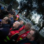CGT Union leader Philippe Martinez (L) speaks with the media as he greets striking workers at The Gravenchon Port-Jerome refinery, owned by US giant Esso-ExxonMobil, at Port-Jerome, northern France on October 12, 2022. - Striking French oil refi...