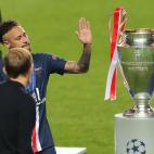 Paris Saint-Germain's Brazilian forward Neymar walks past the trophy after the UEFA Champions League final football match between Paris Saint-Germain and Bayern Munich at the Luz stadium in Lisbon on August 23, 2020. (Photo by Miguel A. Lopes /...