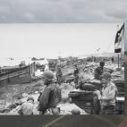 La playa de Omaha, cerca de Vierville-sur-Mer, Francia. En la imagen antigua, las tropas estadounidenses se reparten en tiendas en la playa después del desembarco