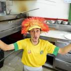 A worker at a pizza store celebrates in San Jose after Costa Rica defeated Uruguay in the FIFA World Cup Brazil Group D match on June 14, 2014. (EZEQUIEL BECERRA/AFP/Getty Images)