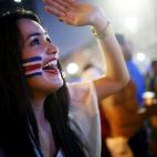 Costa Ricans celebrate while watching their victory over Uruguay at the FIFA Fan Fest on Copacabana Beach on June 14, 2014 in Rio de Janeiro, Brazil. The match was played on the third day of the World Cup tournament. (Photo by Mario Tama/Getty ...